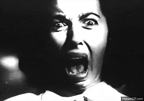Animated gif of a woman in black and white screaming into a camera